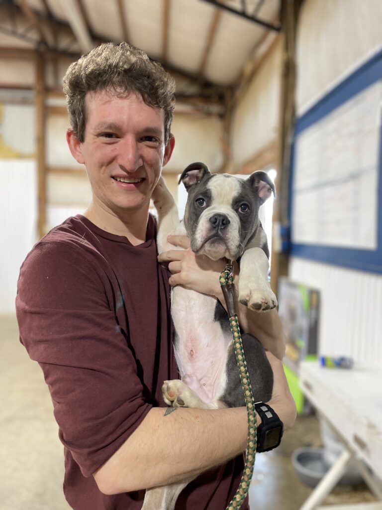 Jesse holding a puppy